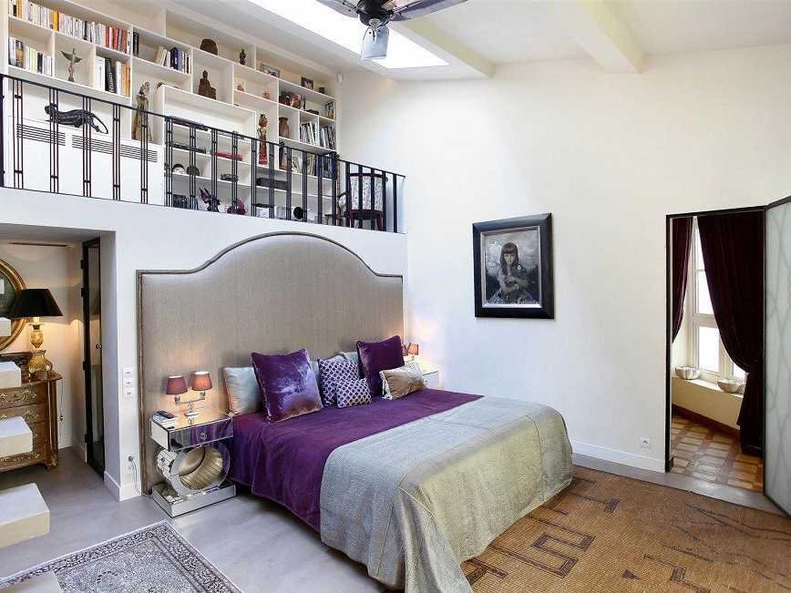this-bedroom-one-of-three-emphasizes-the-high-ceilings-with-a-convenient-loft-storage-space-above-the-bed