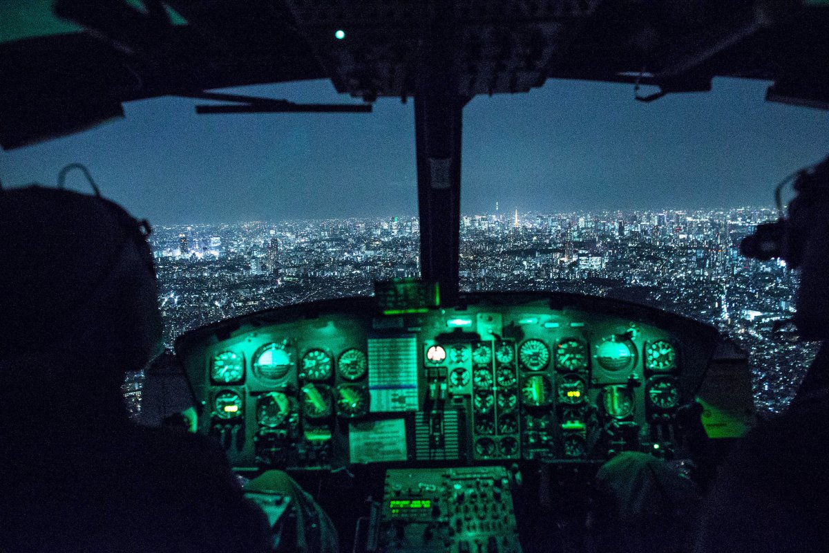capt-jonathan-bonilla-and-1st-lt-vicente-vasquez-459th-airlift-squadron-uh-1n-huey-pilots-fly-over-tokyo-after-completing-night-training-april-25-2016