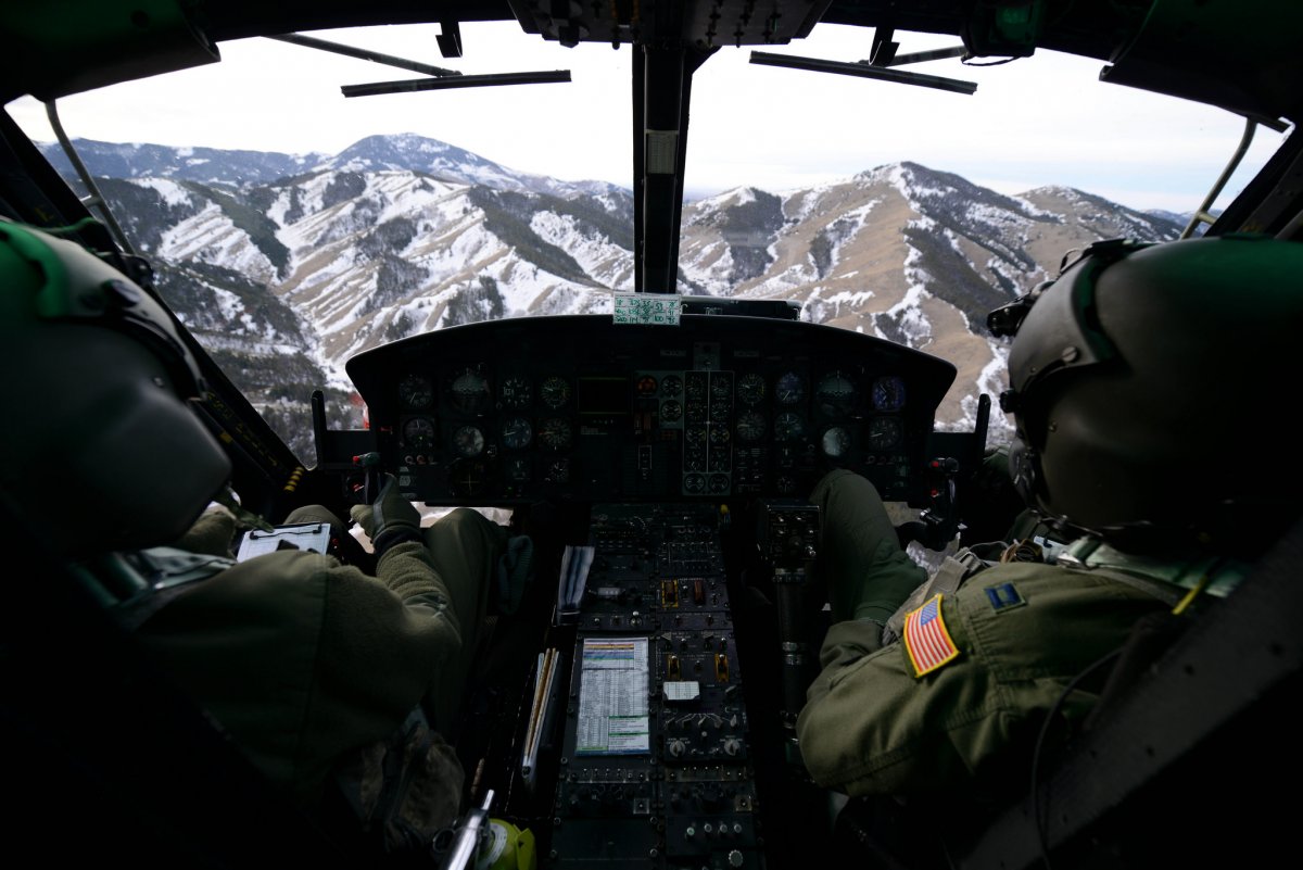 first-lt-greg-johnston-and-capt-rj-bergman-fly-their-uh-1n-iroquois-over-a-mountain-range-january-27-2015-near-malmstrom-air-force-base