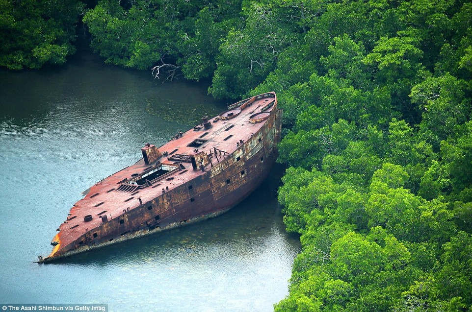 3B12022500000578-4003520-Debris of the United States Naval transport vessel remains abond-m-76 1480982499516