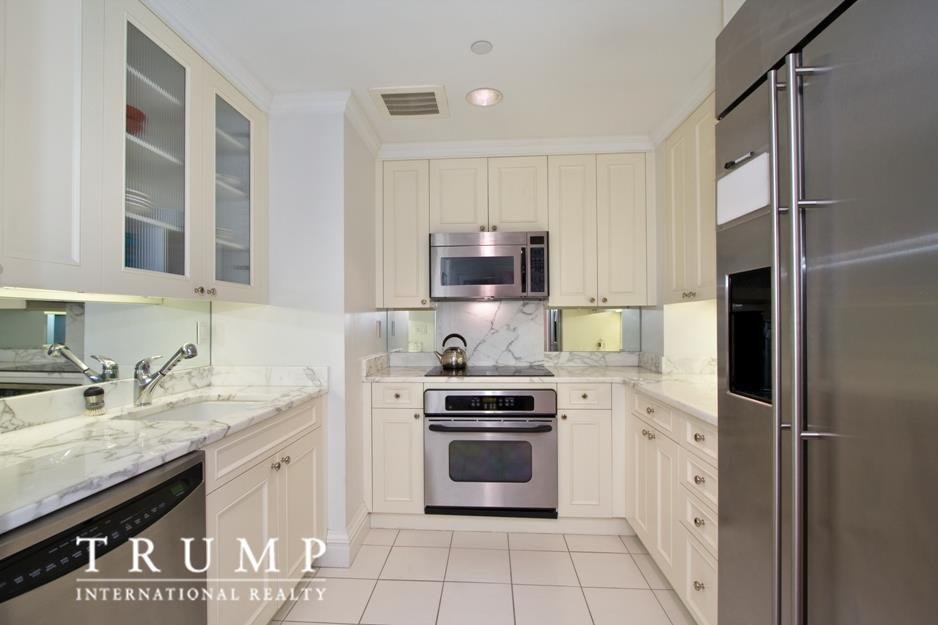 the-kitchen-is-windowless-but-it-includes-marble-countertops
