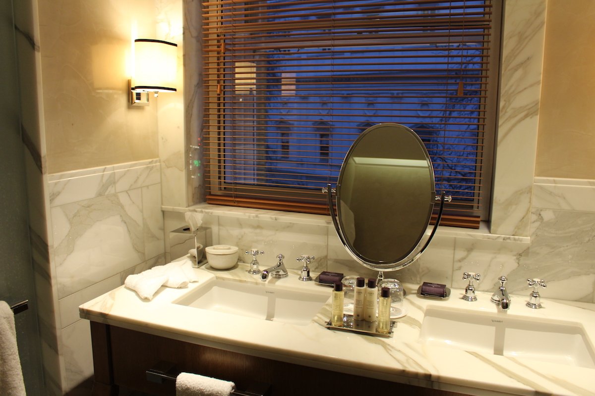 the-main-marble-bathroom-had-underfloor-heating-a-rain-shower-a-separate-toilet-room-and-a-bathtub-with-a-built-in-tv-and-floating-remote