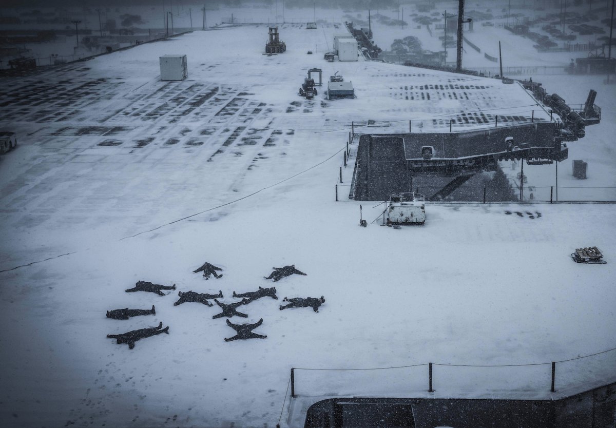 sailors-create-snow-angels-on-the-flight-deck-of-the-aircraft-carrier-uss-dwight-d-eisenhower-on-january-7-after-returning-home-from-a-deployment.jpg